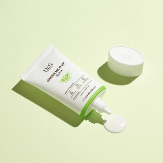 Dr. G Green Mild Up Sun+ SPF50+ PA++++ product shot open with green background