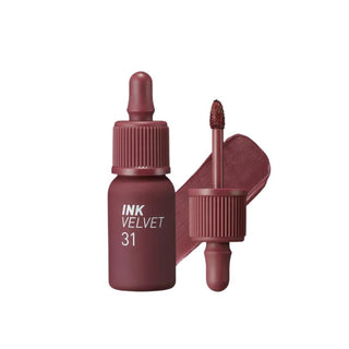 peripera's Ink The Velvet Lip Tint in color 31 Wine Nude, displayed with its doe-foot applicator, which resembles a dropper but is not functional as one. It also includes a swatch of the color.