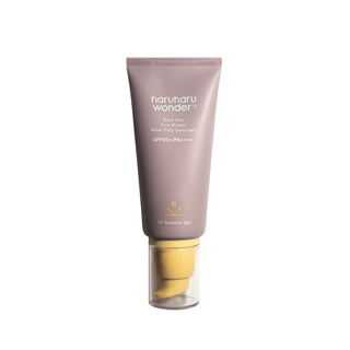 haruharu wonder's Black Rice Pure Mineral Relief Daily Sunscreen SPF 50+ PA++++ in a light purple tube with a yellow pump dispenser and a clear cap. Designed for sensitive skin.