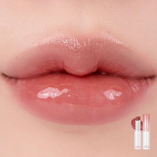 Close-up of the model's lips with rom&nd's Glasting Melting Lip Balm in shade 06 Kaya Fig applied, showing its hydrating and smooth finish.