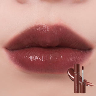 Close-up of rom&nd's Juicy Lasting Tint in color 20 Dark Coconut applied to the model's lips.