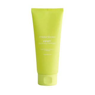 Green tube of moonbow skincare product on a white background