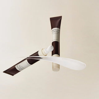 SKIN1004's Madagascar Centella Probio-Cica Bakuchiol Eye Cream shown with the cap off, featuring a special applicator for gentle massaging.