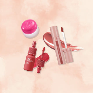 The Warm Babe Lip Kit by PlayLab Beauty, curated by Vanessa and Jeanha, includes rom&nd Juicy Lasting Tint, fwee Lip & Cheek Blurry Pudding Pot, and peripera Ink The Velvet.