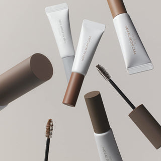 rom&nd's Han All Brow Cara Brow Gel in various colors, with the products and applicators floating around against a neutral background.