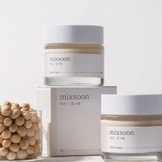 mixsoon's Bean Cream, a nourishing moisturizer with a creamy texture, surrounded by soybeans to highlight its key ingredient.